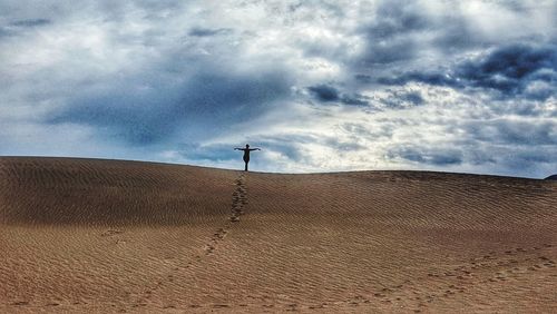 Low angle view of horse on desert against sky