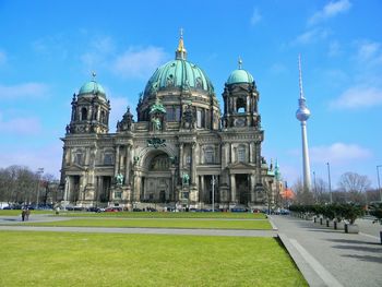 Low angle view of berlin cathedral and fernsehturm against sky