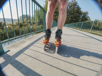 Czechia, 9th of october 2018. roller skater ride in park. legs in in-line hard shell boots blades.