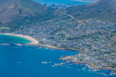 High angle view of sea and mountains against sky