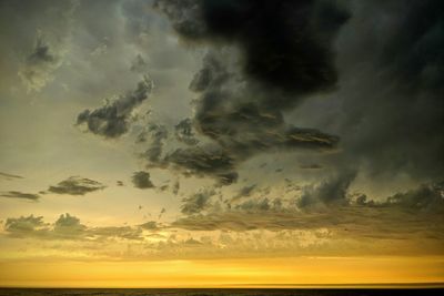 Scenic view of dramatic sky during sunset