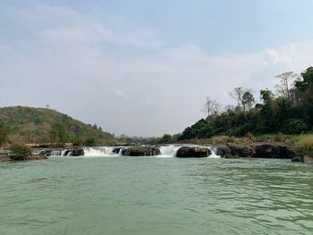 Scenic view of river against sky