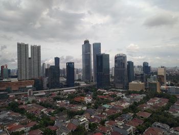 High angle view of modern buildings in city against sky