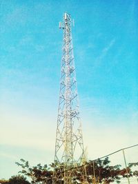 Low angle view of communications tower against sky