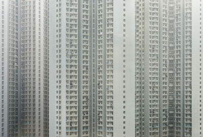 Low angle view of illuminated buildings against sky in city