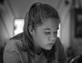 Close-up of teenage girl using phone