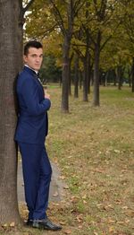 Portrait of smiling man standing in park