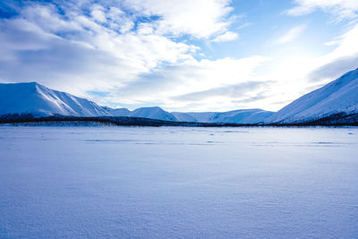 Scenic view of frozen lake against sky