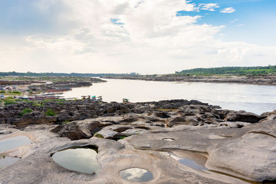 Scenic view of beach against sky