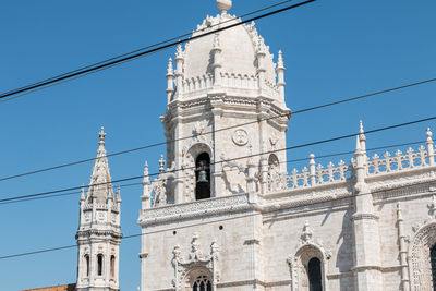 Low angle view of building against blue sky