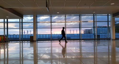 Reflection of woman on glass window