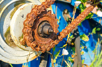 Rusty chain on gears of old mechanism, motor.