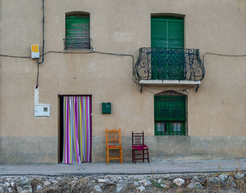 A abandoned and dilapidated stone house facade