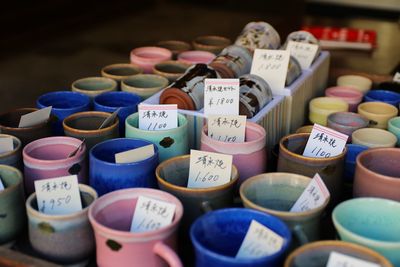 Close-up of various cups with labels