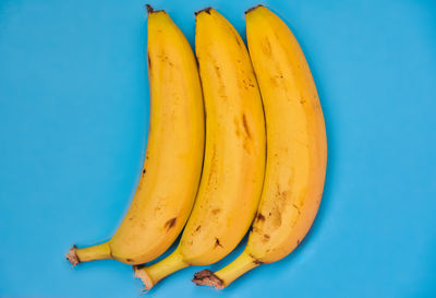 Close-up of bananas against blue background