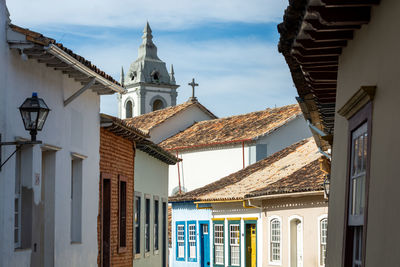 Low angle view of buildings in city against sky