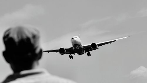 Airplane flying against the sky