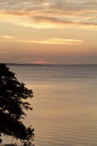 Scenic view of sea against orange sky