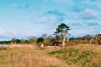 Built structure on field against sky