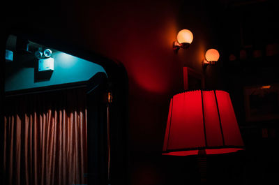 Close-up of illuminated lamp at night