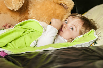 Young child lying in bed