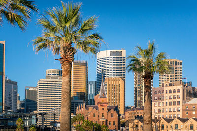 View of modern buildings against blue sky