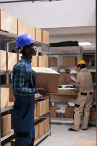 Rear view of man working at construction site