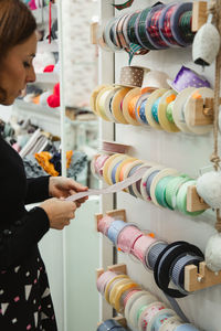 Midsection of woman standing in store