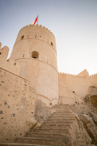 Low angle view of fort against clear sky