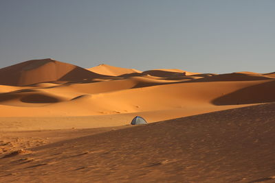 Scenic view of desert against clear sky