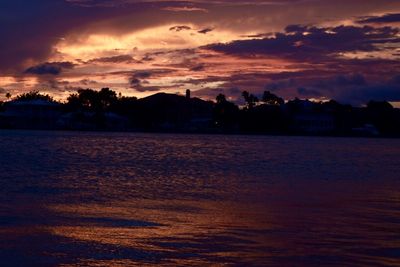 Scenic view of dramatic sky over sea during sunset