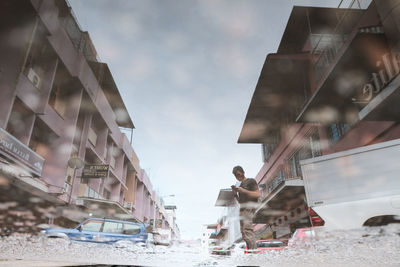 People on street against sky