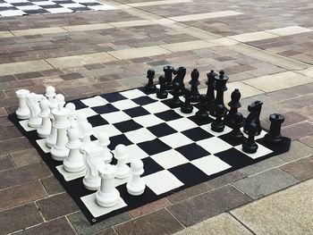 High angle view of chess pieces on floor