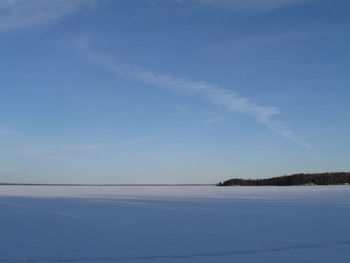 Scenic view of sea against sky during winter