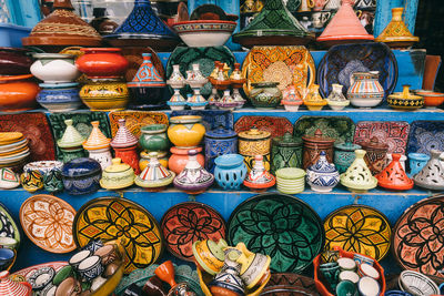 Moroccan style pots, dishes, plates on shelf, with thousands of colours