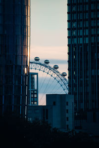 Low angle view of ferris wheel against sky