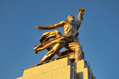Low angle view of statue against sky