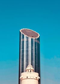 Low angle view of building against blue sky