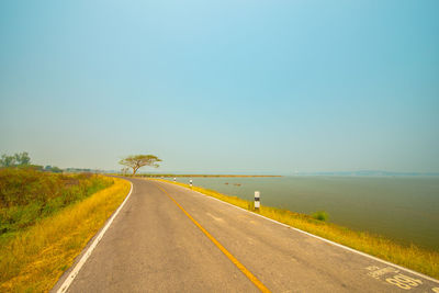 Empty road against clear sky