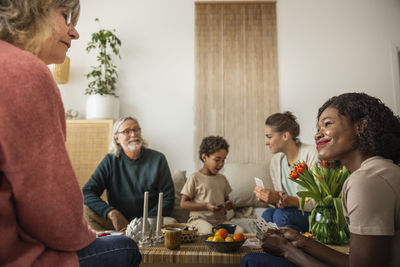 Family playing cards at home