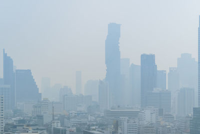 Modern buildings in city against sky