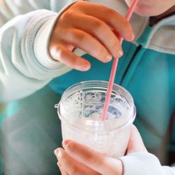 Close-up of a hand holding drink