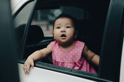 Portrait of girl in car