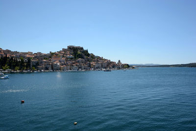 Scenic view of calm sea against clear sky