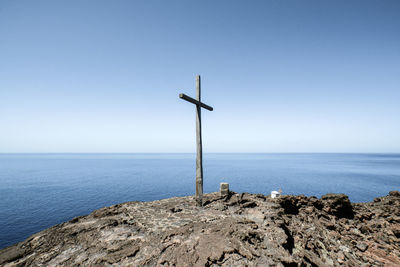 Scenic view of sea against clear blue sky