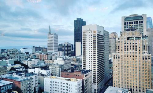 Modern buildings in city against sky