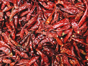 Full frame shot of red chili peppers at market
