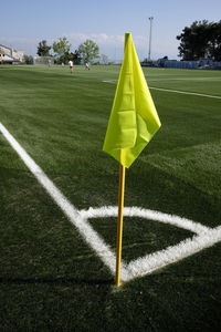 Soccer field against cloudy sky