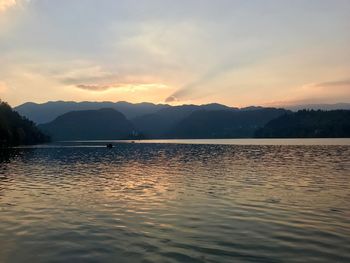 Scenic view of lake against sky during sunset