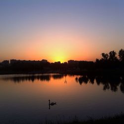 Scenic view of lake at sunset